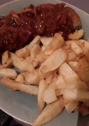 A picture of Sig's Porkloin Steak with Pepper & Onion Sauce.