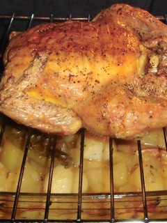 Una foto de Pollo Asado abierto al horno