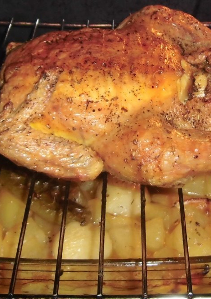 Una foto de Pollo Asado abierto al horno