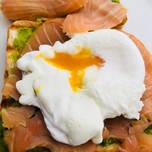 Poached egg on avocado mashed and smoke salmon on toast