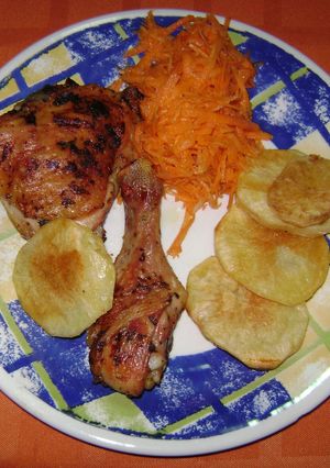 Una foto de Pollo con papas al horno