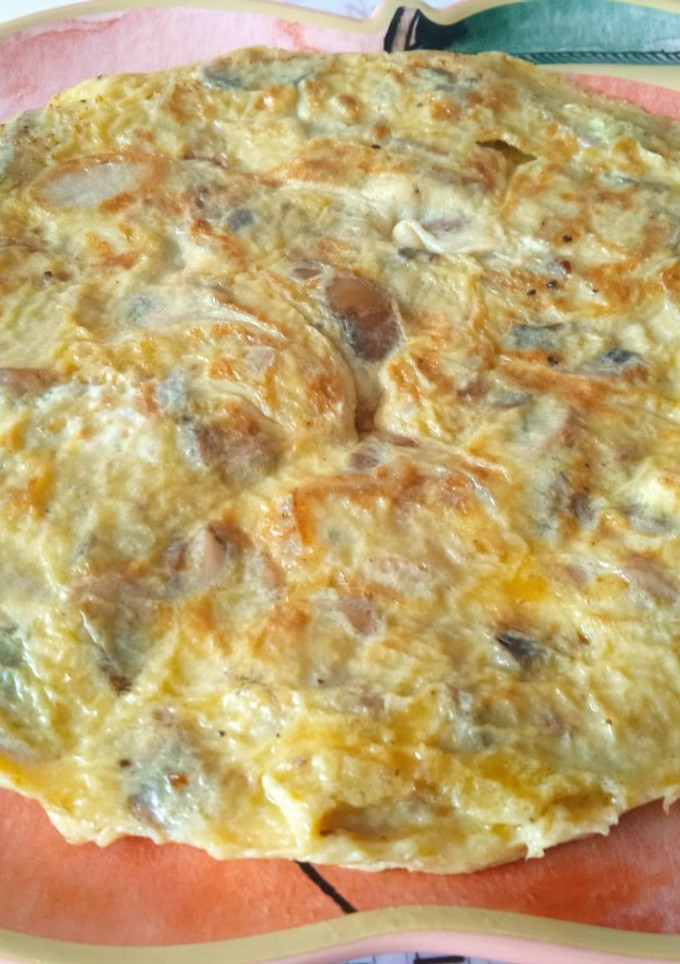 Una foto de Tortilla de champiñones y cebolla