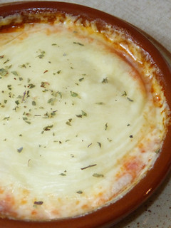 Una foto de Provolone gratinado