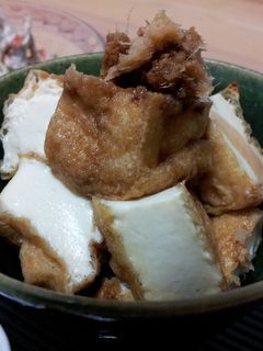 A picture of Toasted Atsu-Age (deep fried tofu) with Ginger Shoyu.