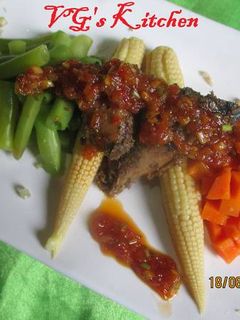 A picture of Steamed Fish with Sambal (IKAN KUKUS).