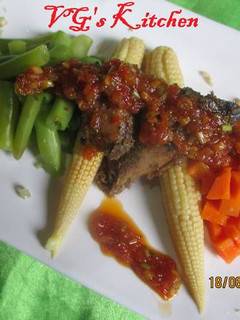 A picture of Steamed Fish with Sambal (IKAN KUKUS).