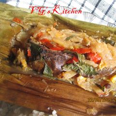 A picture of Dried Fish and Young Mango Wrapped in Banana Leaves (PEPES IKAN KERING).