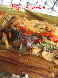 A picture of Dried Fish and Young Mango Wrapped in Banana Leaves (PEPES IKAN KERING).