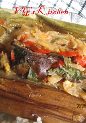 A picture of Dried Fish and Young Mango Wrapped in Banana Leaves (PEPES IKAN KERING).