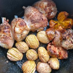A picture of Air Fryer Chicken and Hasselback Potatoes.