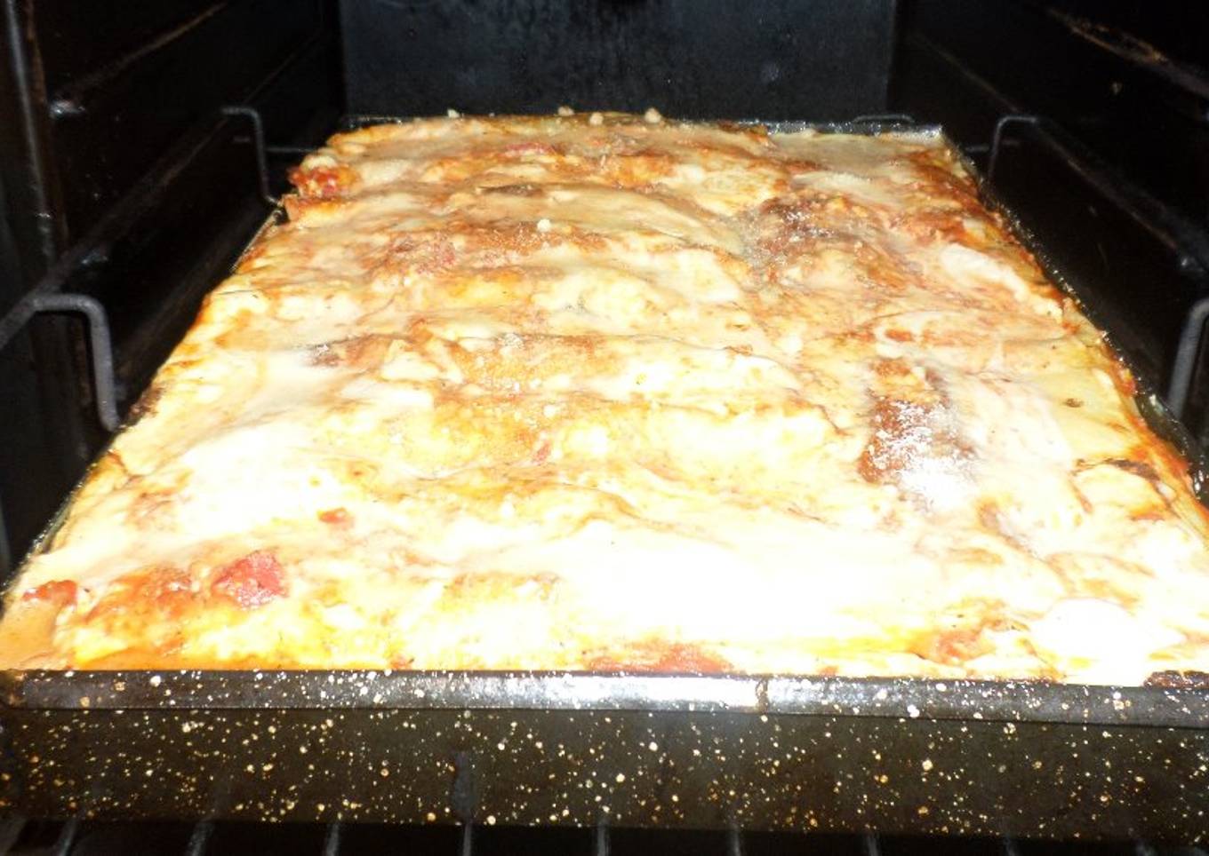 Canelones de acelga, ricota, nuez y pollo