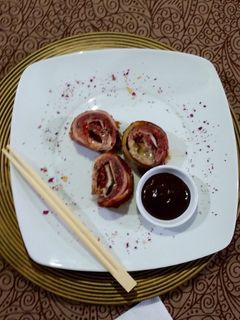 Una foto de Rollo de carne molida envuelto en tocino