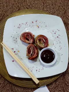 Una foto de Rollo de carne molida envuelto en tocino
