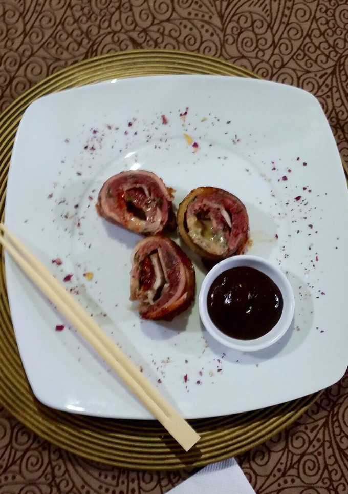 Una foto de Rollo de carne molida envuelto en tocino