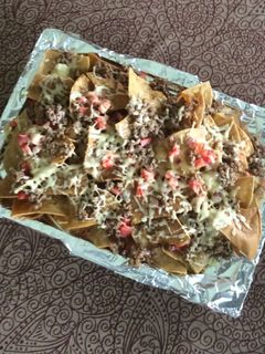 A picture of Nachos with Ground Beef and Crispy Melted Cheese.