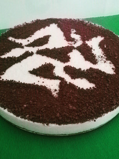 Una foto de Tarta de queso con ralladura de chocolate
