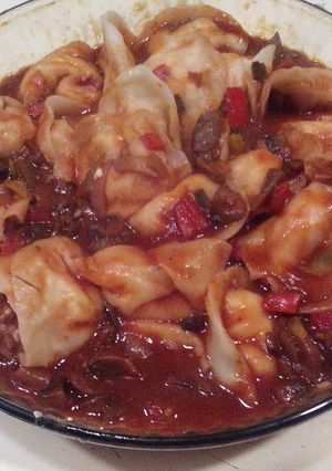 Una foto de Agñolotis de ricota y salame con salsa funghi