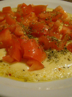 Una foto de Provoleta Entomatada