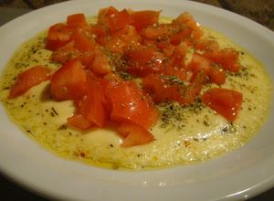 Una foto de Provoleta Entomatada