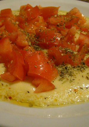 Una foto de Provoleta Entomatada