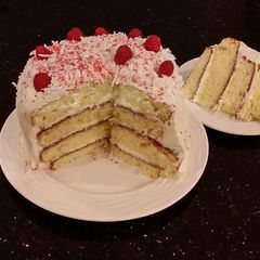 A picture of Vanilla Lemon Raspberry Layer Cake with Whipped Cream Buttercream Frosting.