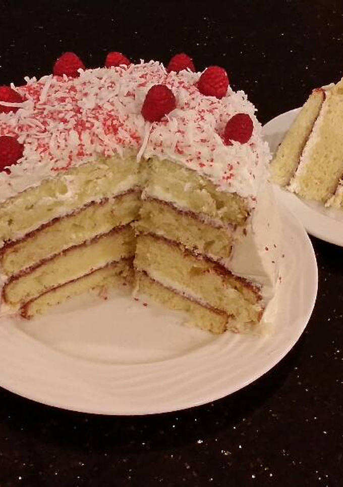 A picture of Vanilla Lemon Raspberry Layer Cake with Whipped Cream Buttercream Frosting.