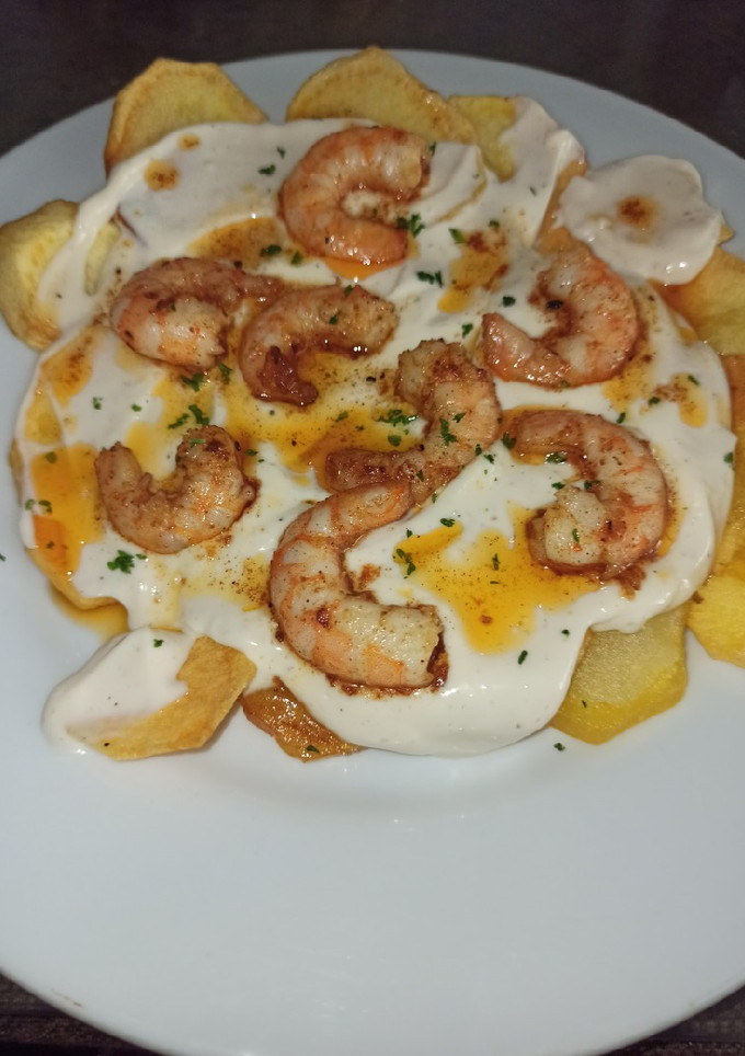 Una foto de Papas arrieras 🥔🦐😋