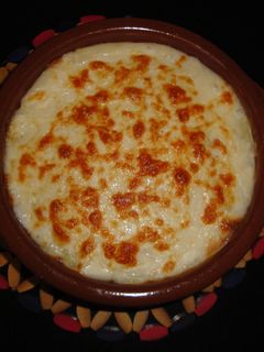 Una foto de Lasaña de patata con bacon y gambas