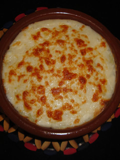 Una foto de Lasaña de patata con bacon y gambas