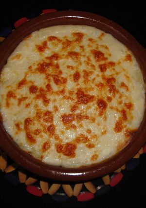 Una foto de Lasaña de patata con bacon y gambas