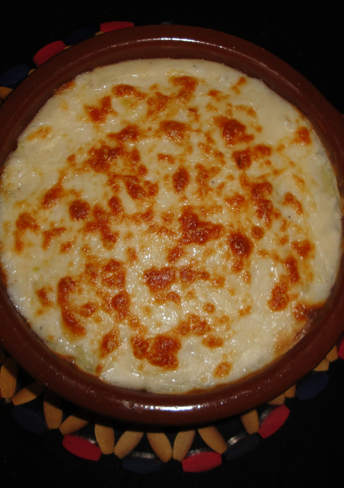 Una foto de Lasaña de patata con bacon y gambas