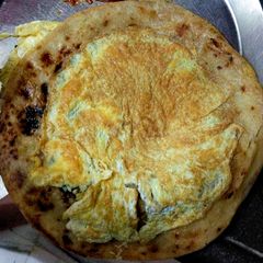 A picture of Omelette with Paratha.