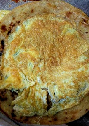 A picture of Omelette with Paratha.
