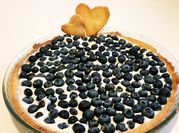 Una foto di yogurt alla vaniglia e mirtilli