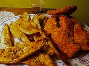 Una foto de pollo frito con paprika