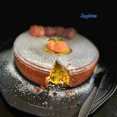 A picture of Coconut pineapple and chocolate Orange cake Eggless.