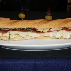 A picture of Serrano ham sandwich on a baguette.