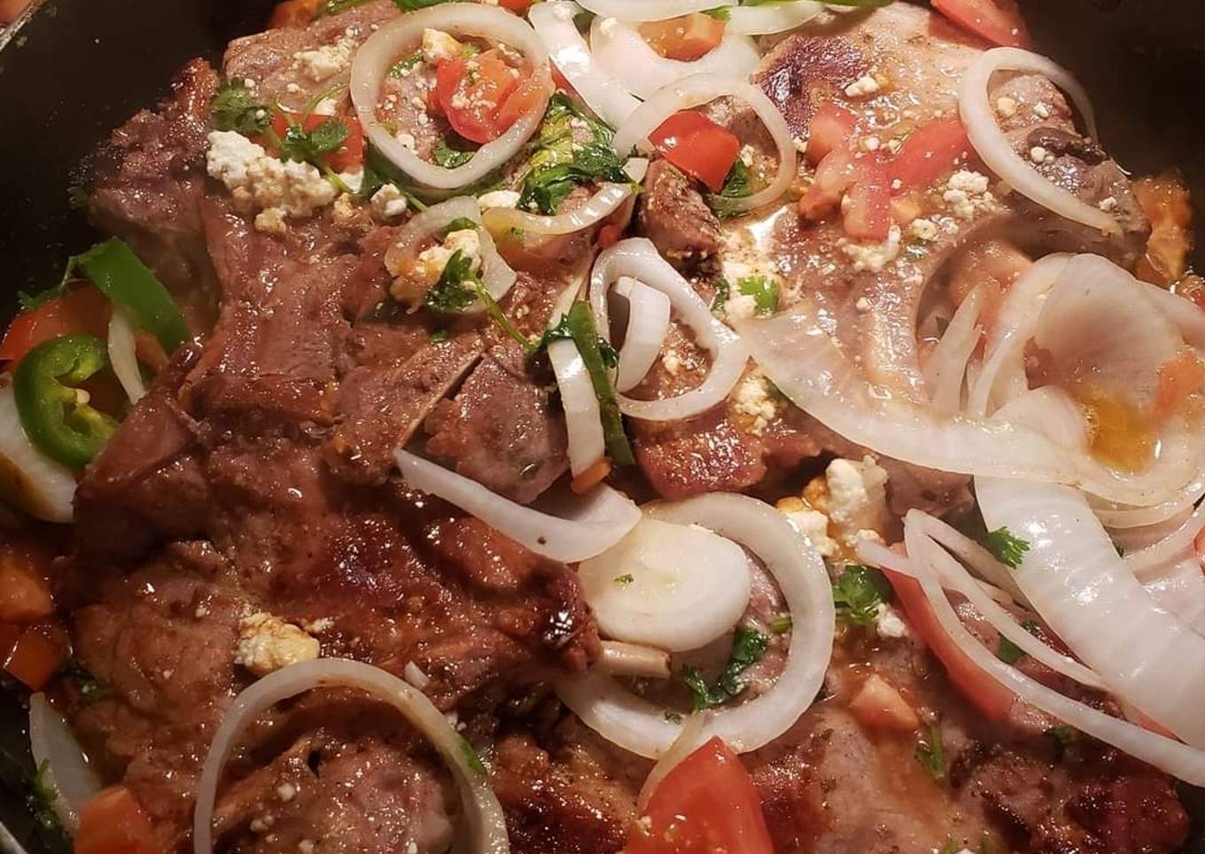 Pork chops with tomatoes and onions and jalapenos