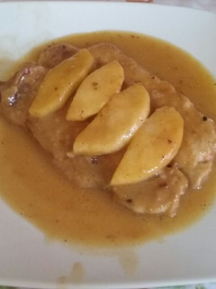 Una foto de Lomo con salsa de naranja