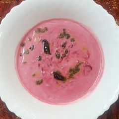 A picture of Beetroot raita with flavoured tadka.