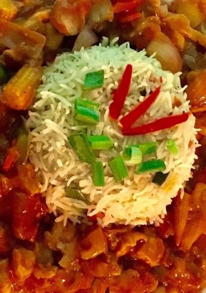 A picture of Sweet and sour chicken with veg fried rice.