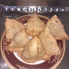 A picture of Chicken veg Samosas.