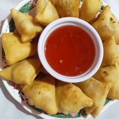 A picture of Corn cheese samosa.