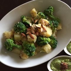 A picture of Sautéed broccoli and potatoes.