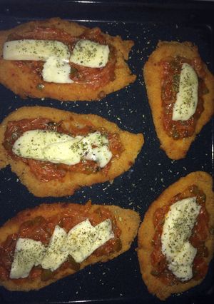 Una foto de Suprema pizaiola con guarnición de puré de calabaza