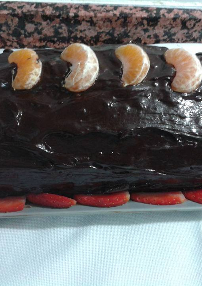 Una foto de Pastel cremoso de mandarinas y cobertura de chocolate