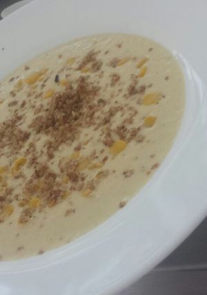 Una foto de Crema de Elotes y Polvo de Nuez