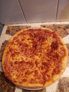 Una foto de Pizza gratinada de muzarella