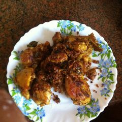 A picture of Spicy Chicken fry in coconut flakes.
