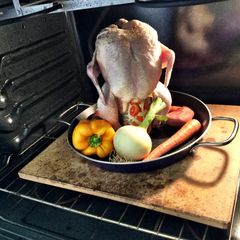 A picture of Beer Can Chicken in an oven!.